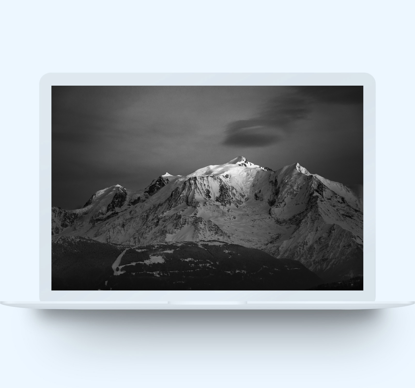 Laptop computer showing black & white photo of Mont Blanc